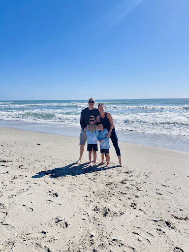 Nataliya and Alex with their family on the beach